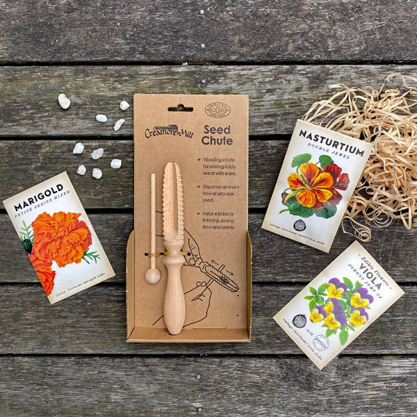 Heirloom Seed Pack includes Marigold seeds, Nasturtium Seeds and edible Viola flower seeds together with a wooden seed chute.