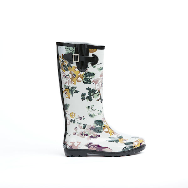 Gumboot in pretty floral print on white background. 100% waterproof rubber with cotton lining, pull-on.