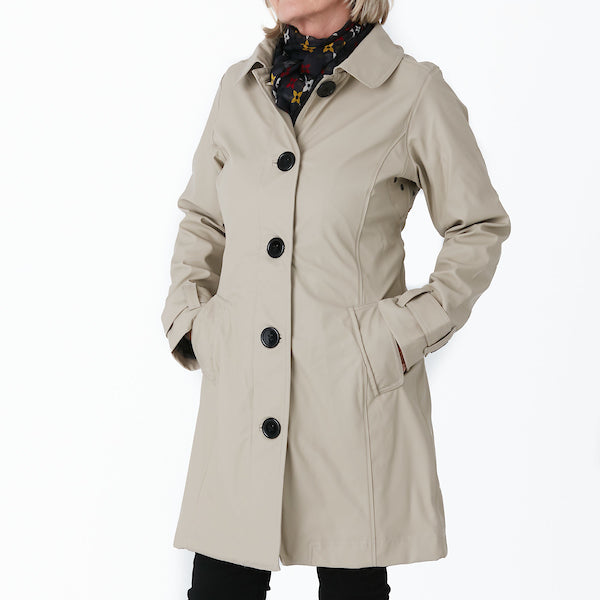 Raincoat by Pipduck in beige polyurethane, fully lined with detachable hood.