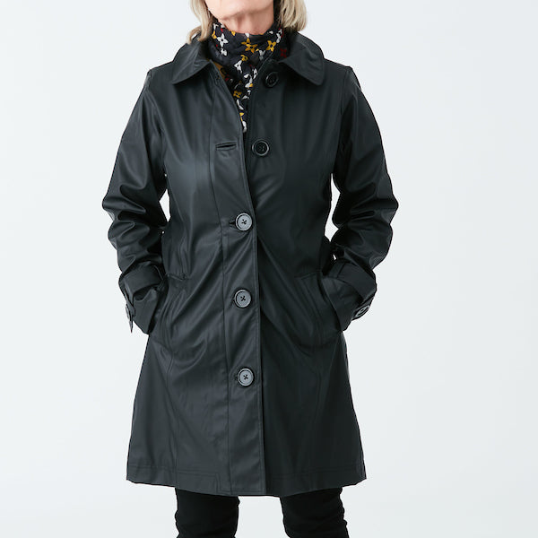 Raincoat by Pipduck in black polyurethane, fully lined with detachable hood.