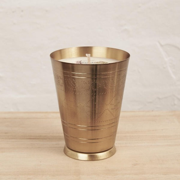 Hand poured soy candle in brass lassi cup. Choose from the fragrances of Botanica, Wildflower & Honey, or Tonic.